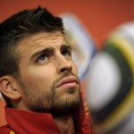 Spain's defender Gerard Pique gives an o