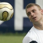 Italy's De Rossi looks at ball during World Cup soccer training session in Duisburg