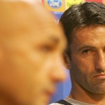 Roma's Christian Panucci (R) watches his